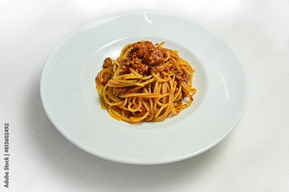 Gourmet plate of bolognese spaghetti isolated on a white background Gourmet plate of bolognese spaghetti isolated on a white background