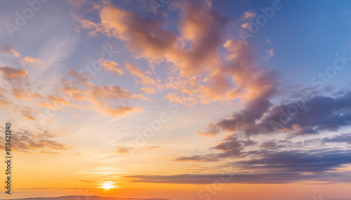 Real majestic sunrise sundown sky background with gentle colorful clouds.