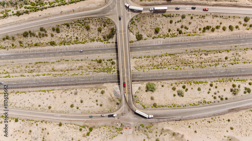 Photo of a landscape of roads with cars in the desert from a height. Drone photo
