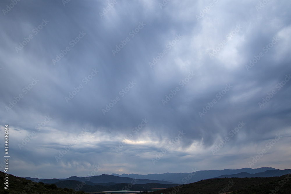 Fototapeta premium Rolling cloudscape over the hills in the Boland region of the Western Cape province in South Africa