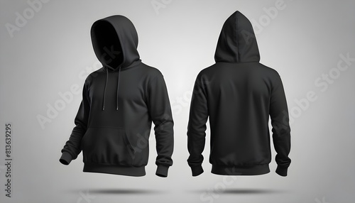 Two black hoodies laid out on a plain gray background
