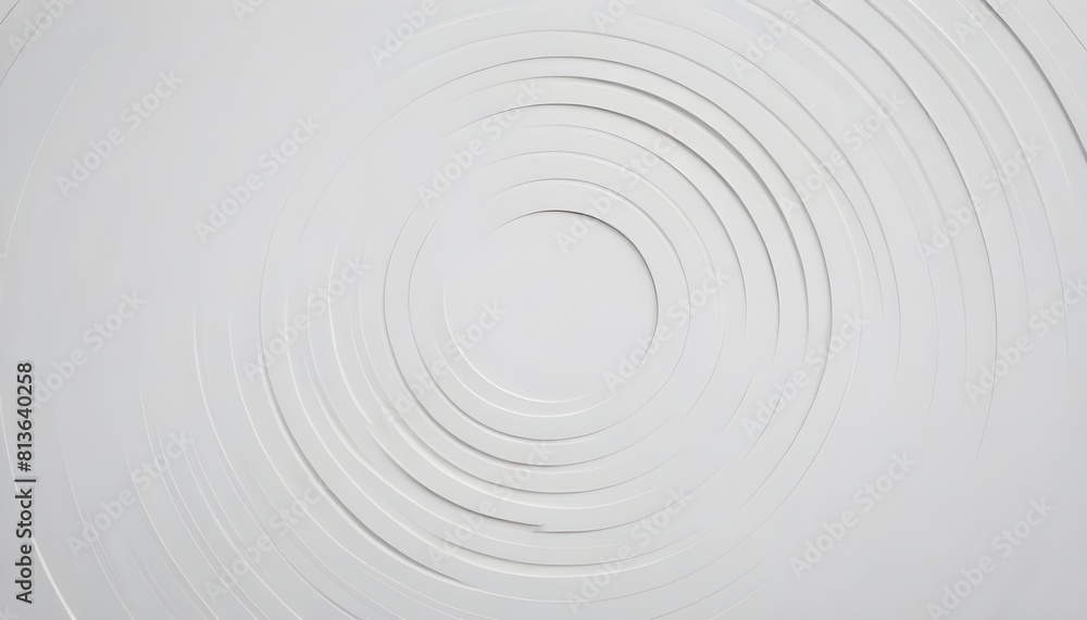 A white wall with a spiral pattern painted in black, creating a mesmerizing visual effect