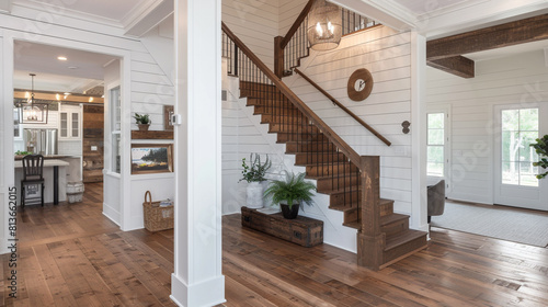 Modern farmhouse interior with a staircase framed by shiplap walls, a vintage wood banister, and rustic charm.