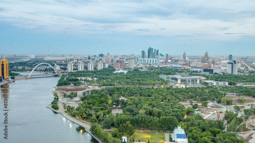 Elevated view over the city center with river and park and central business district day to night Timelapse, Kazakhstan, Astana Elevated view over the city center with river and park and central business district day to night Timelapse, Kazakhstan, Astana