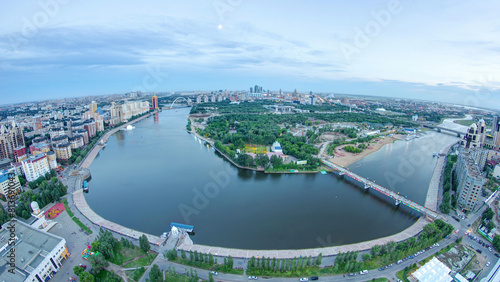 Elevated view over the city center with river and park and central business district day to night Timelapse, Kazakhstan, Astana photo