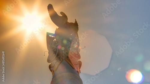 Sun passing over Stele monument Kazakh Eli with bird Samruk timelapse. photo