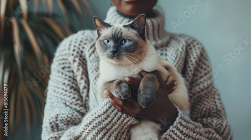 Woman Holding Siamese Cat