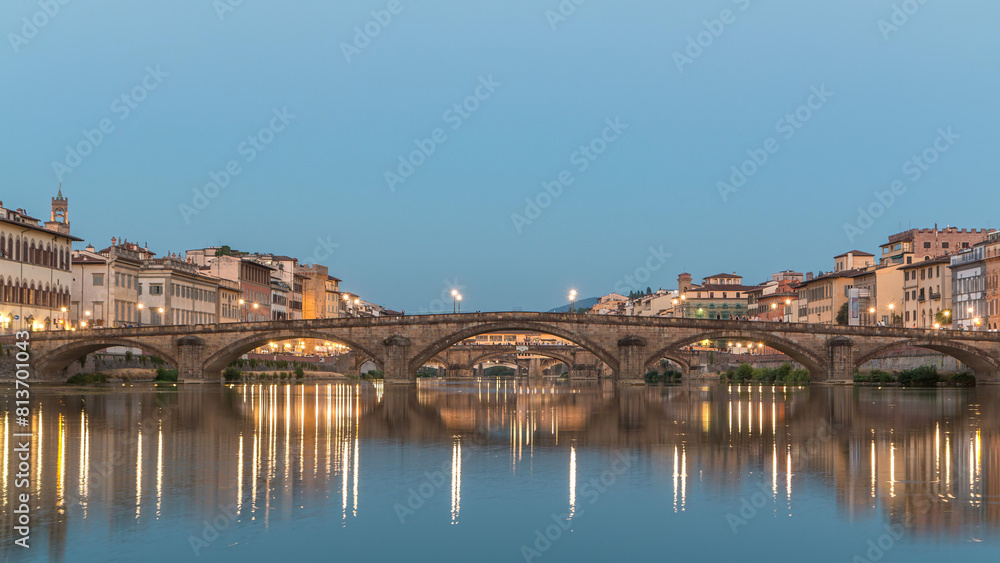 Fototapeta premium Ponte Alla Carraia and Santa Trinita Holy Trinity Bridge day to night timelapse over River Arno in Florence