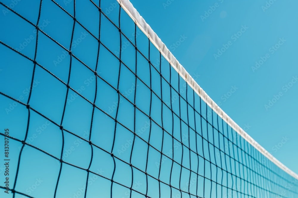 Vivid beach volleyball net under blue sky, ideal for summer olympic games concept Vivid beach volleyball net under blue sky, ideal for summer olympic games concept