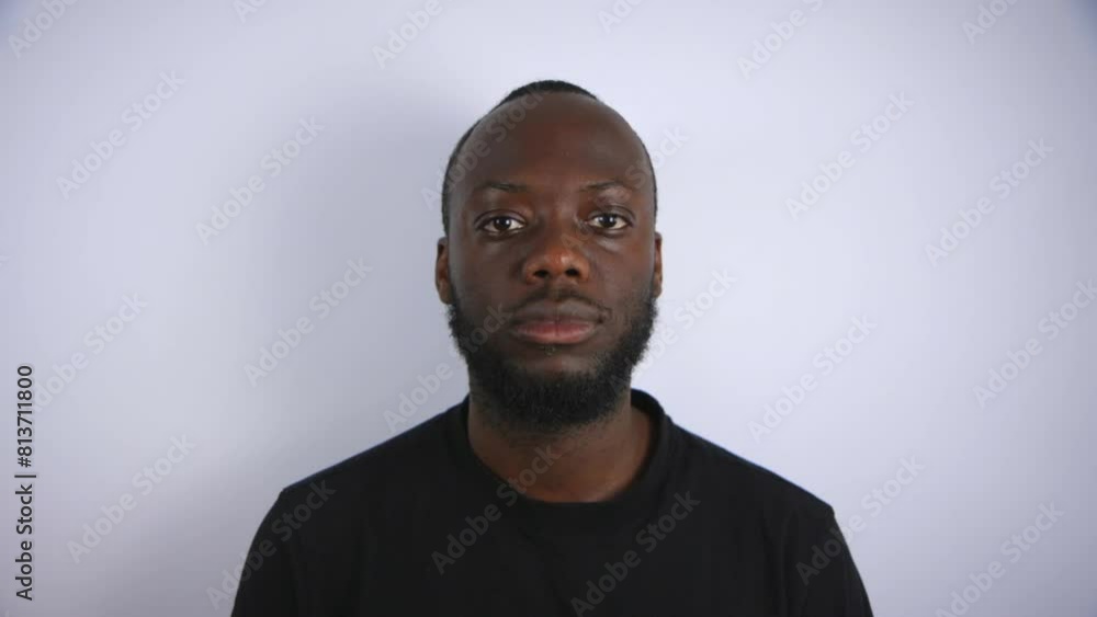 Black Male Staring Into Camera With A Blank Face With White Background Black Male Staring Into Camera With A Blank Face With White Background