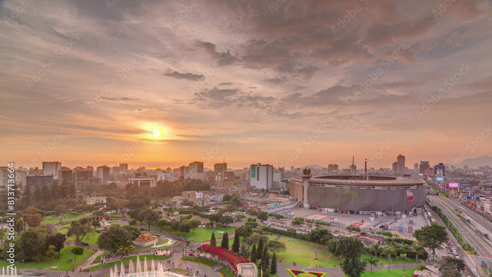 Fototapeta premium Aerial sunset view of the National stadium in the Peruvian capital Lima with Park of the Reservey timelapse
