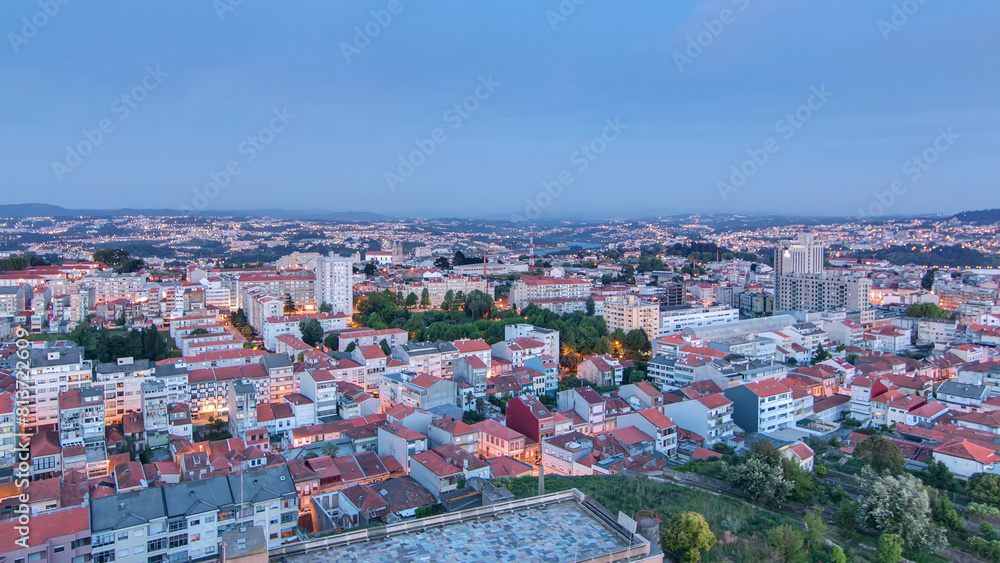 Obraz premium Rooftops of Porto's old town on a warm spring evening timelapse day to night, Porto, Portugal