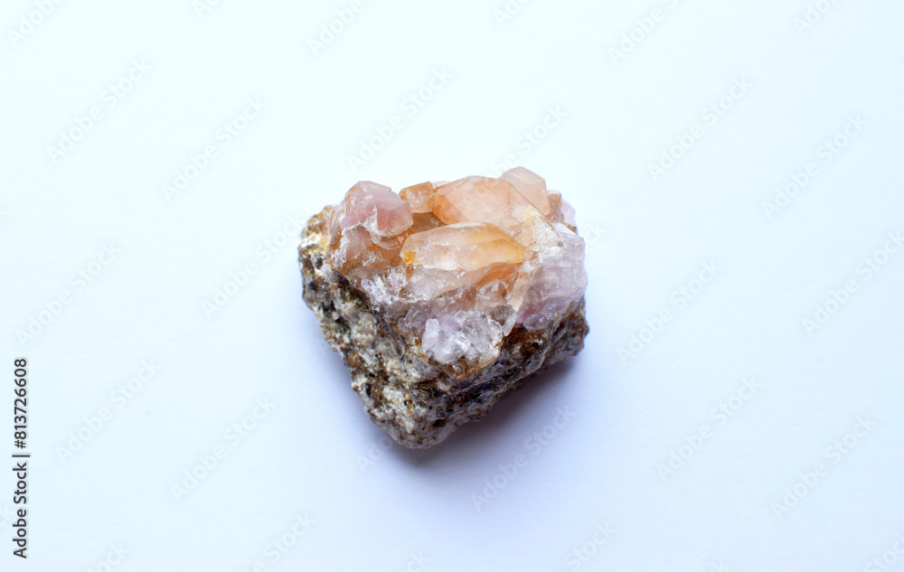 Beautiful druse of natural rose mineral quartz on a white background. Healing chakra crystals. Beautiful druse of natural rose mineral quartz on a white background. Healing chakra crystals.