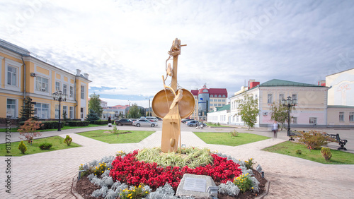 Sculpture with flowers and the building of Kazakh Drama Theatre in Uralsk timelapse hyperlapse.
