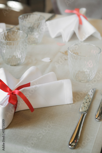 Serving cutlery and decorating a table for an event in a restaurant