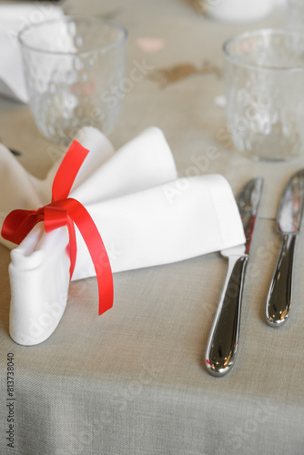 Napkin and cutlery on a decorated table for an event in a restaurant