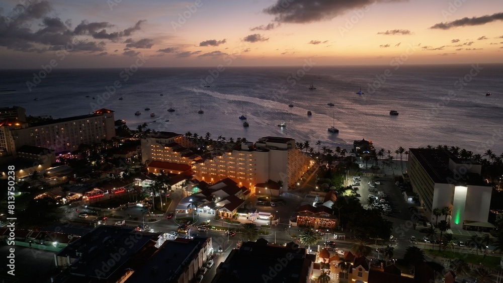 Fototapeta premium Sunset Skyline At Oranjestad Caribbean Netherlands Aruba. Aerial Beach Oranjestad Caribbean Netherlands. Construction Landscape Company Building Beauty.