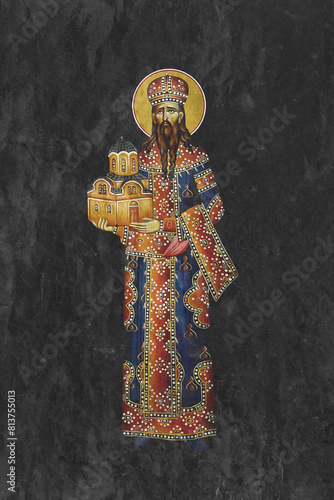 Christian traditional image of Saint Stefan Milutin. Religious illustration on black stone wall background in Byzantine style