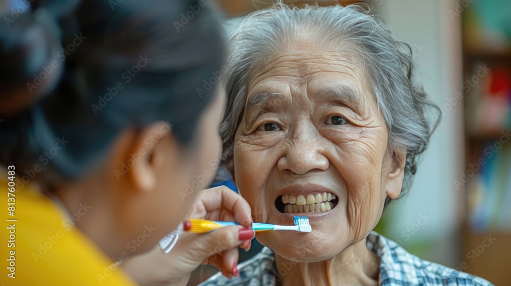A woman is brushing the teeth of an elderly woman A woman is brushing the teeth of an elderly woman