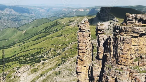 Rocks of two monks, Bermamyt plateau, Karachay-Cherkess Republic. The top of the cliff. Incredible natural epic landscape of the Caucasus, Elbrus region. 4K  photo