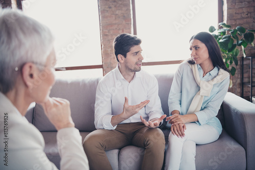 Portrait of young married couple fight speak consultation visit psychotherapist loft interior office indoors