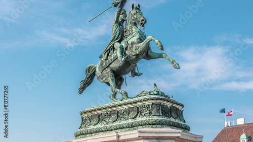 Statue rider Erzherzog Karl on horseback with flag in hand timelapse. Heldenplatz. Vienna photo