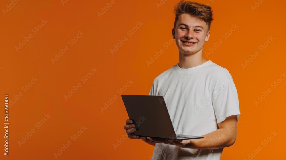 Young Man Holding Laptop