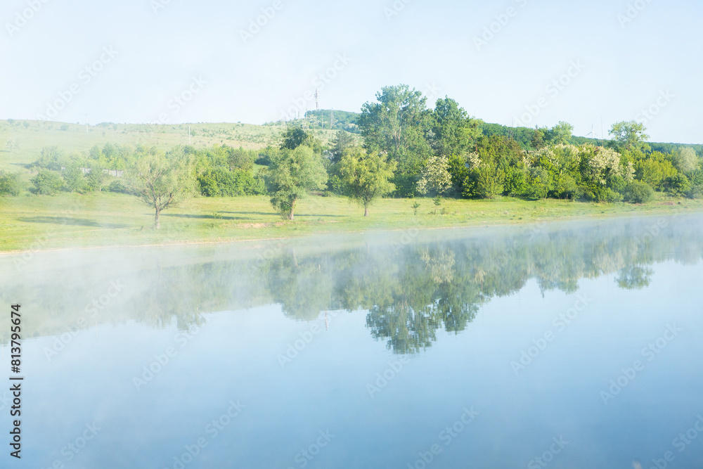 Beautiful summer landscape with green trees, green meadows on the bank of the river in Republic of Moldova. Beautiful summer landscape with green trees, green meadows on the bank of the river in Republic of Moldova.