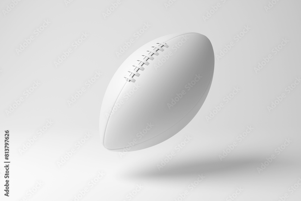 White American football floating in mid air on white background in monochrome and minimalism. Illustration of the concept of sports leagues, team games and competition White American football floating in mid air on white background in monochrome and minimalism. Illustration of the concept of sports leagues, team games and competition