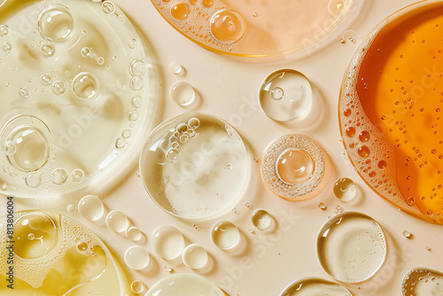 serum or oil swatches in different textures on a pastel light orange background