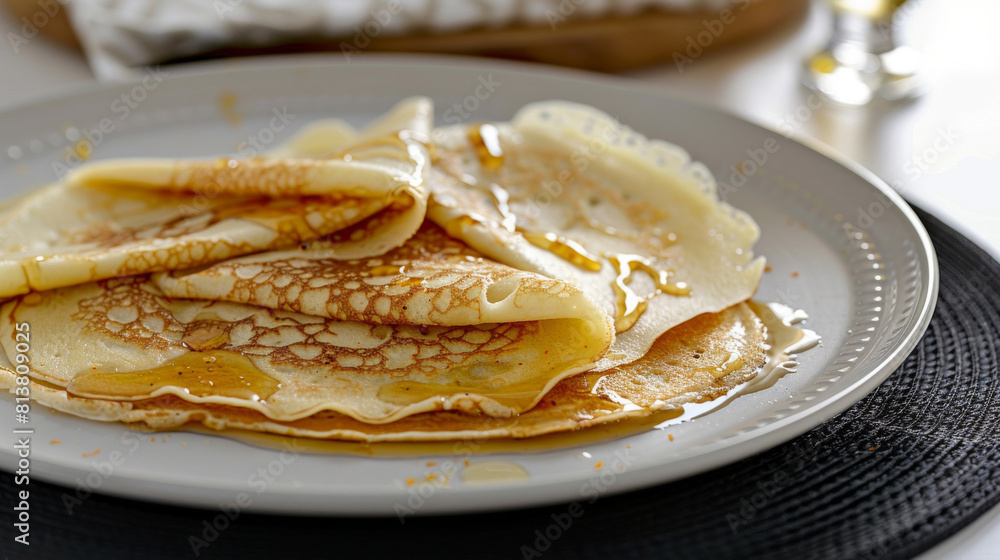 Close-up of delicious moroccan crepes drizzled with honey, served on a white plate, capturing the essence of moroccan cuisine Close-up of delicious moroccan crepes drizzled with honey, served on a white plate, capturing the essence of moroccan cuisine