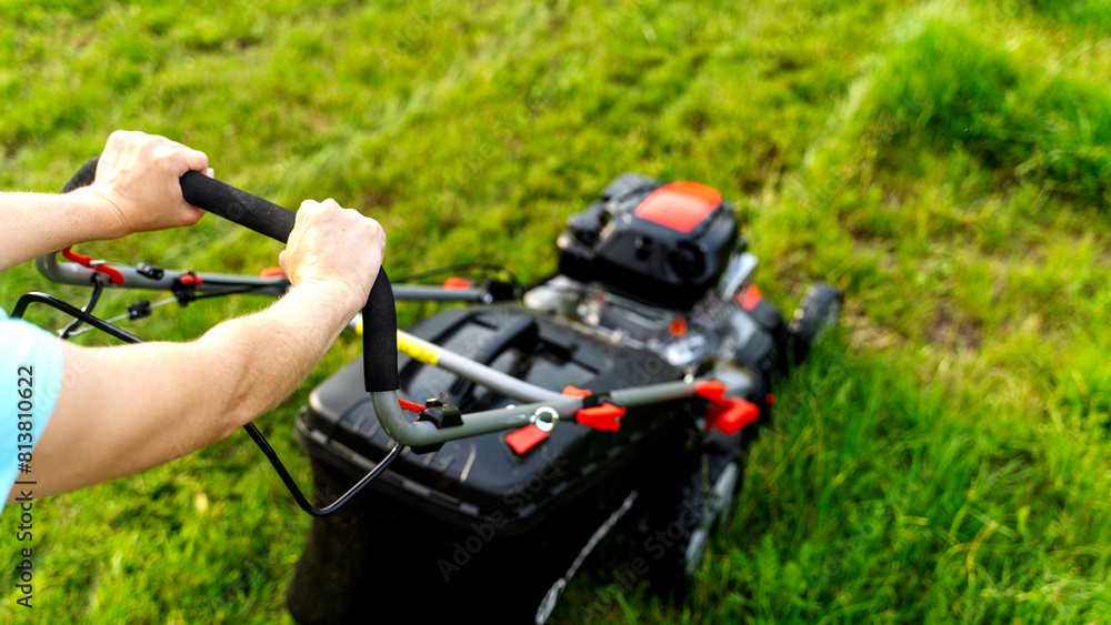 Lawn mower on a green flat lawn on a sunny day Lawn mower on a green flat lawn on a sunny day