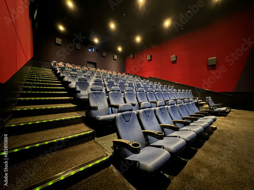 Empty cinema theatre interior with seats.