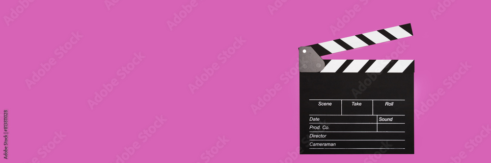 Obraz premium Cinema clapper board on a pink background, copy space, cinematography, production, action,banner