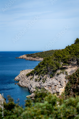 sea side shore in la victoria town in mallorca spain on a chilly day - blue waters and blue sky