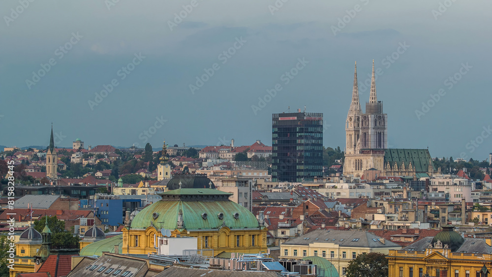 Fototapeta premium Zagreb cathedral and modern skyscraper with a old city panorama day to night timelapse