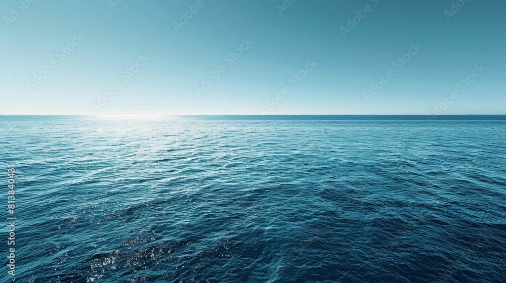 Obraz premium A panoramic view of a big, blue ocean stretching as far as the eye can see, under a clear sky