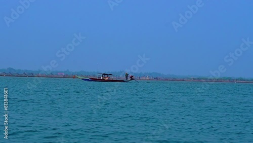 people rowing a boat in beautiful blue sea chilika lake video photo