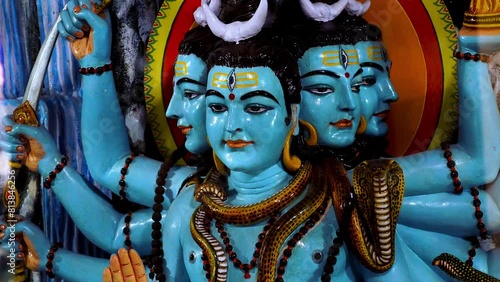 white statue of god shiva with multiple heads and arms panchmukhi shika video photo
