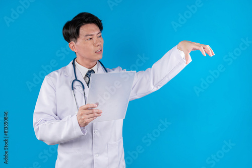 Smart doctor holding transparent tablet hodling object 3D in searching disease research data in futuristic technology attempting remedy therapy healthcare innovation interface hologram. Contrivance. photo