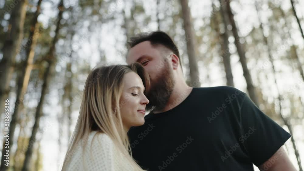 A loving young couple gently embraces in a serene forest setting, sharing a tender moment together surrounded by nature. Romantic Young Couple Sharing a Tender Moment in Forest A loving young couple gently embraces in a serene forest setting, sharing a tender moment together surrounded by nature. Romantic Young Couple Sharing a Tender Moment in Forest