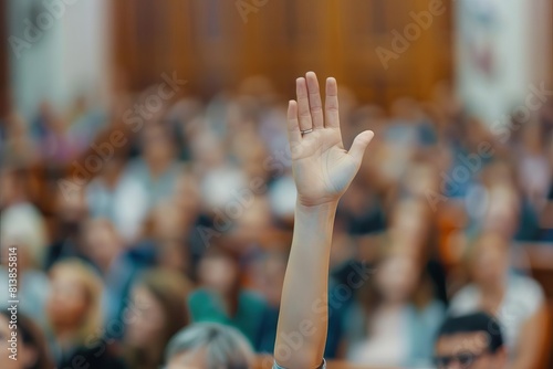 raised hand in blurred crowd at council meeting democracy concept photo