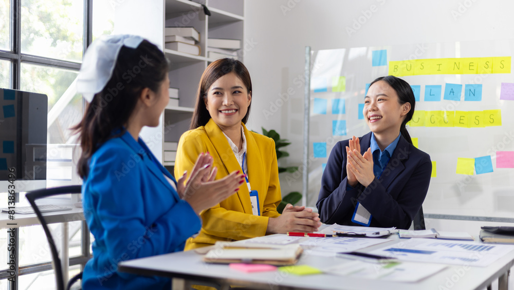 Business meeting, employees are applauding, congratulating and motivation their co-workers. Conference presenting successful business ideas in the office. Business meeting, employees are applauding, congratulating and motivation their co-workers. Conference presenting successful business ideas in the office.