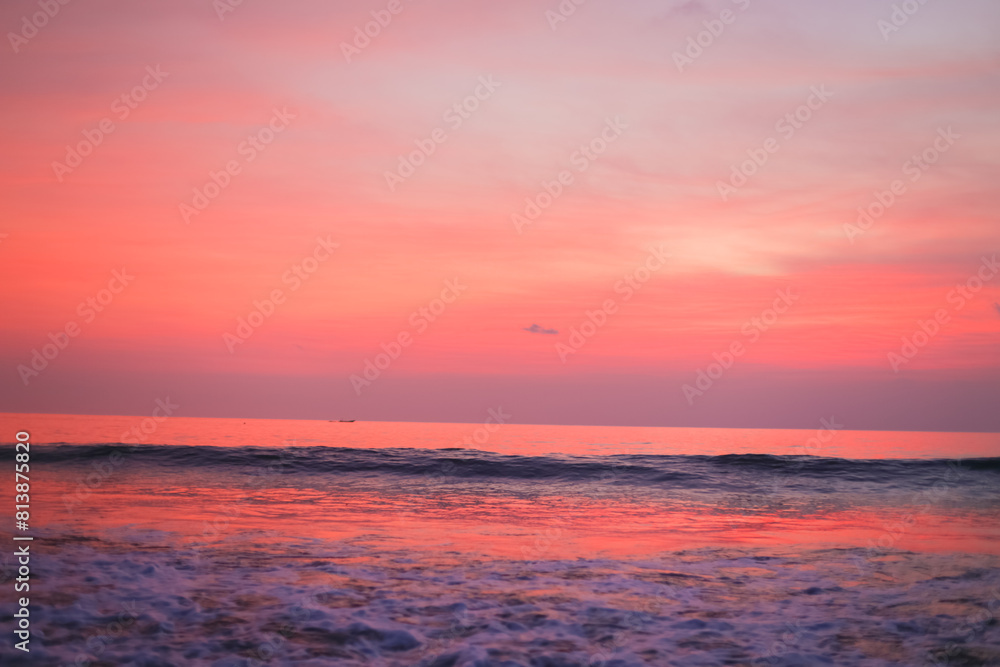 Beautiful pink sunset and clouds over the ocean. Delicate peach sunset background Beautiful pink sunset and clouds over the ocean. Delicate peach sunset background