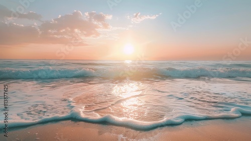 A tranquil beach scene at twilight  with the sun dipping below the horizon  casting a warm glow over the ocean waves.