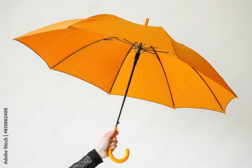image of a hand holding a orange umbrella on white background 