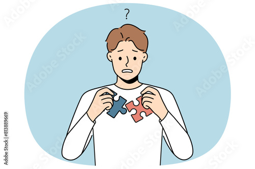 Confused man unable to join puzzle pieces. Frustrated guy brainstorm think about jigsaw connection. Problem solution and dilemma. Vector illustration.