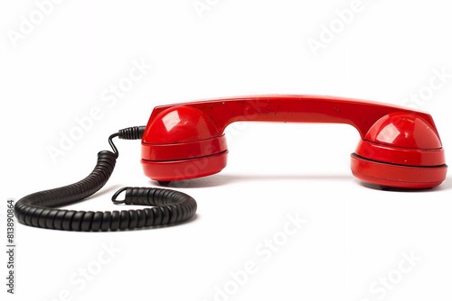 red colored old fashioned retro phone reciever with black telephone wire isolated white background with copy space. business problem solution communication support service concept photo