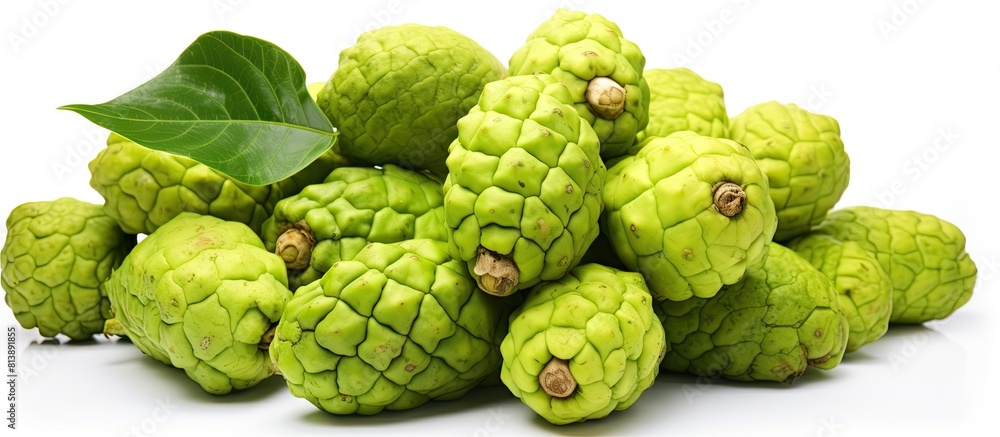 Fototapeta premium Noni fruits displayed on a white background providing ample copy space for creative use