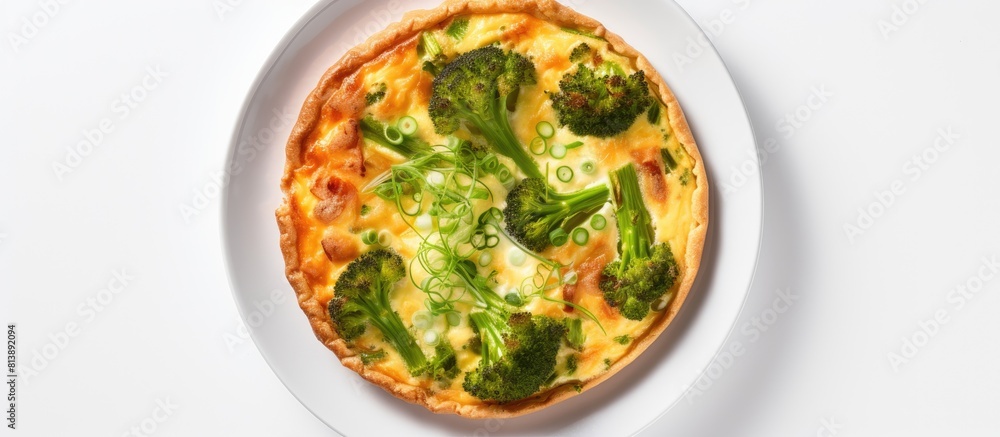 A homemade quiche tart made with red fish and broccoli presented from a top view on a white background inviting you to use the copy space image A homemade quiche tart made with red fish and broccoli presented from a top view on a white background inviting you to use the copy space image